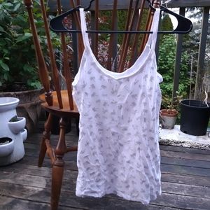 white sleeveless shirt w/ silver palm tree pattern